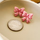 Classic Holiday Bow Studs - Pink Glitter