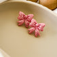 Classic Holiday Bow Studs - Pink Glitter